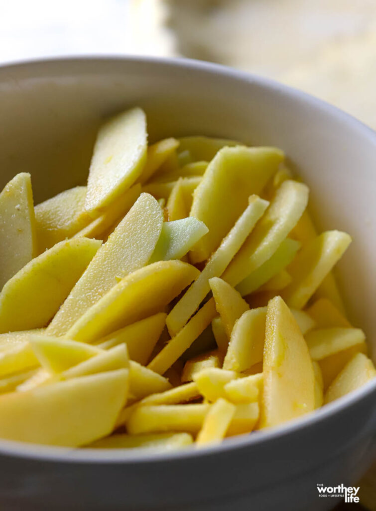 a pot filled with sliced apples