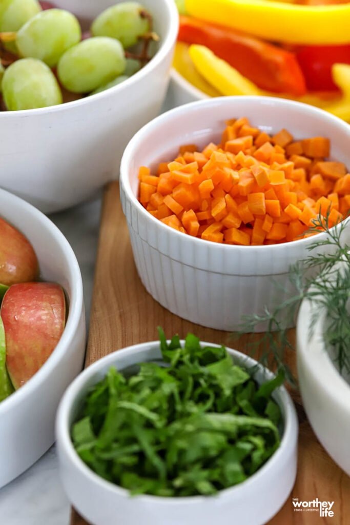 Ingredients to make deviled egg dip in whilte bowls