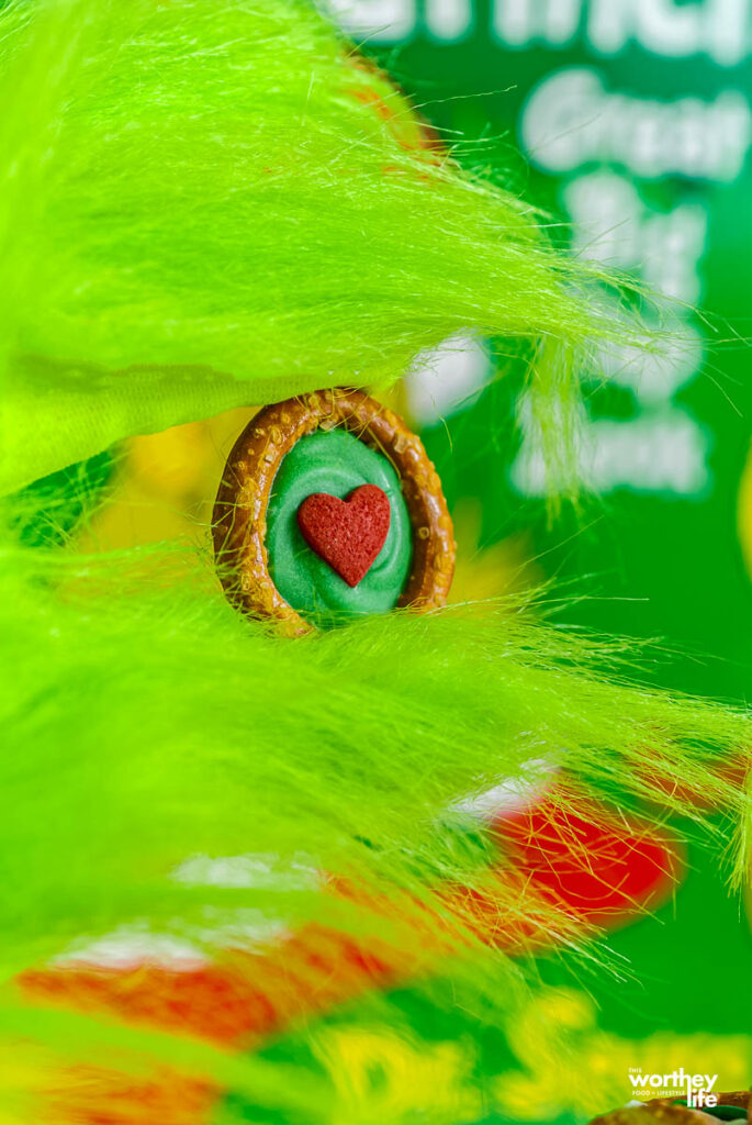 grinch holding a grinch snack