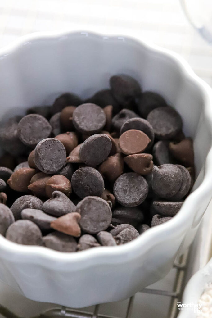 a small white bowl filled with chocolate chips