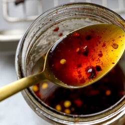 Hot Honey recipe in mason jar with gold spoon