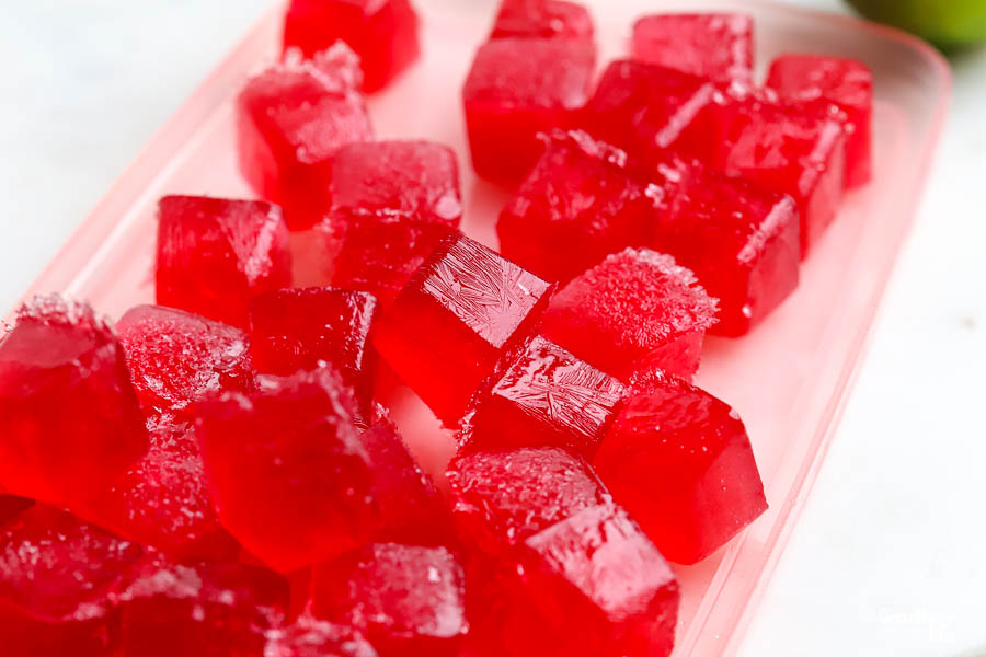 miniature cranberry ice cubes are perfect in this tropical inspired cocktail