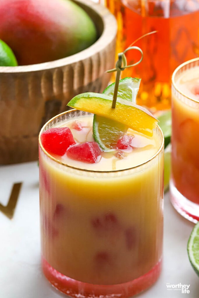 Mango Sour served in a ribbed rocks glass. 