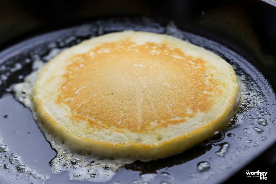 cooking a pancake in cast iron skillet