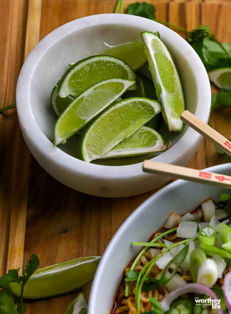 fresh lime wedges are served with our Mexican ramen. 