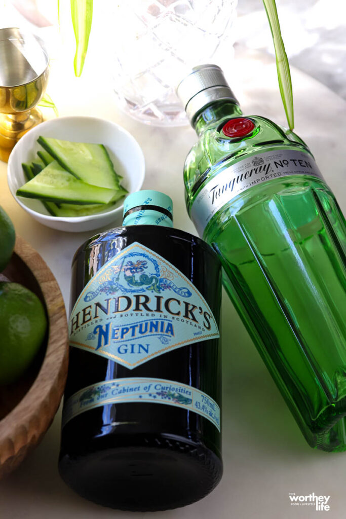 Bottles of Gin laying on a white marble counter