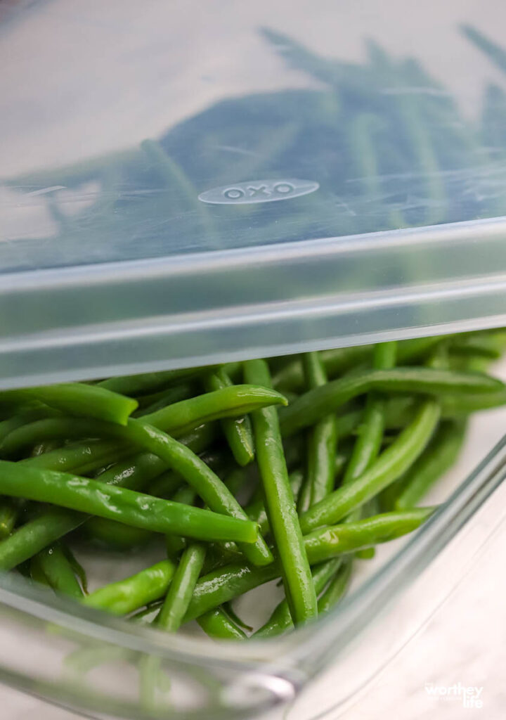 Blanched French green beans stored in an air-tight container. 