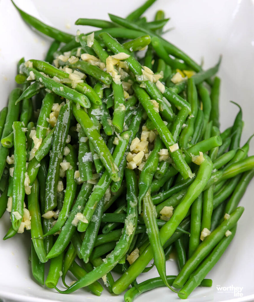 Honey Garlic Butter Green Beans served in a large white bowl.