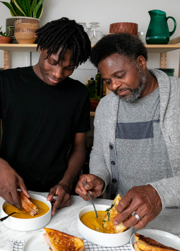 Dad and son making food