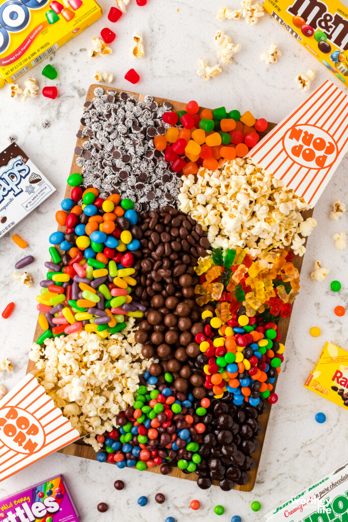 A variety of theater candy on a wooden board