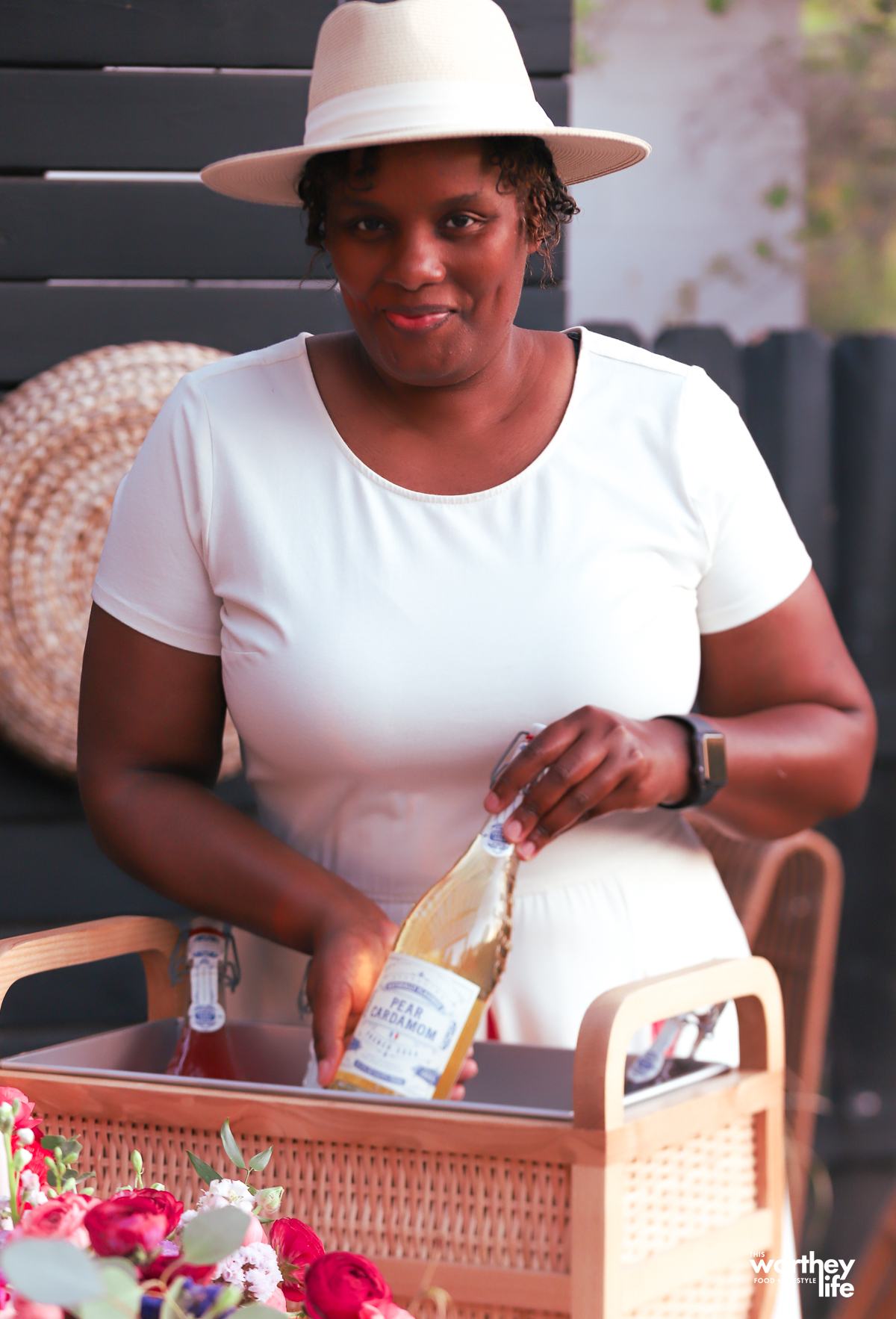 Woman serving drinks at an outdoor brunch