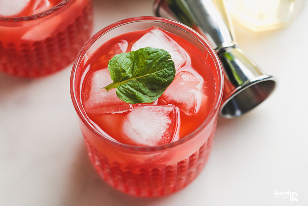 Raspberry Drink with fresh mint on top with ice. 