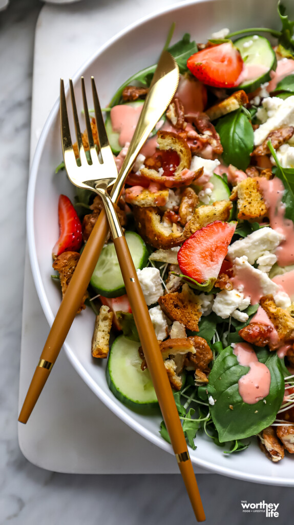 Strawberry Arugula Salad with a knife and a fork