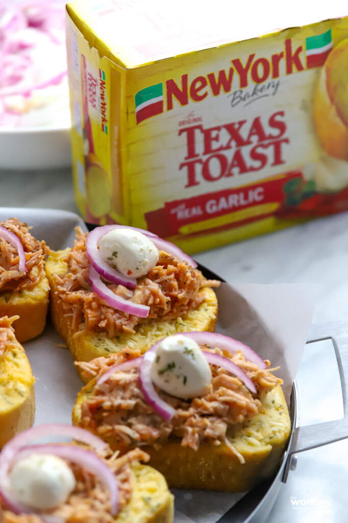 BBQ Texas Toast Pizza on a cooking with a box of Texas Toast in the background.