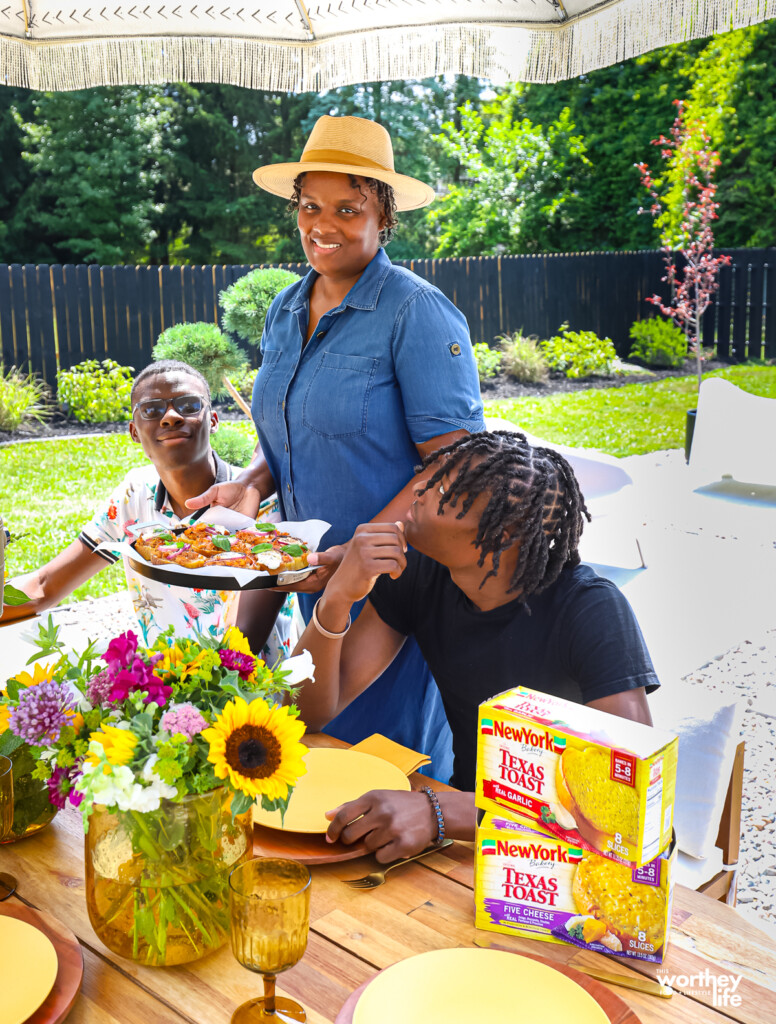 Mom and sons enjoying pizza outdoors