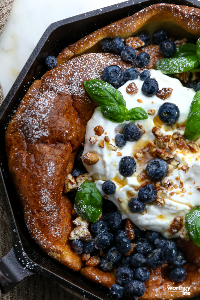 Side view of a blueberry Dutch baby. 