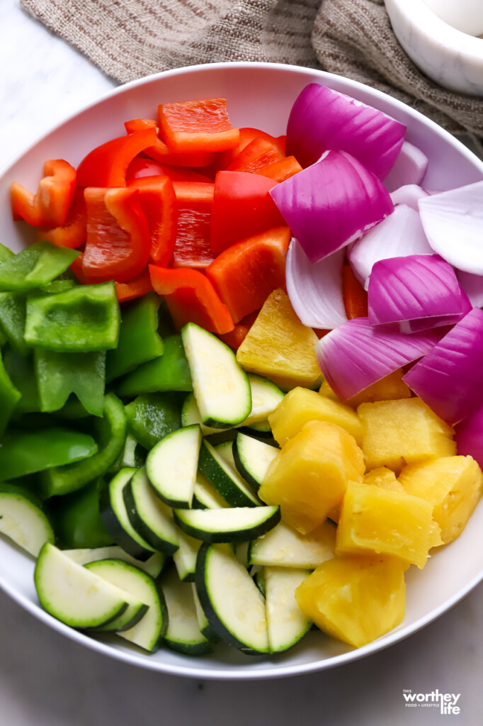 A mixture of vegetables in a white bowl.