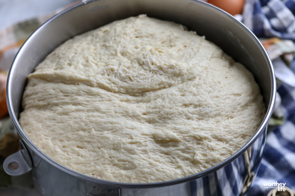 Dough in a mixing bowl that has doubled in size. 