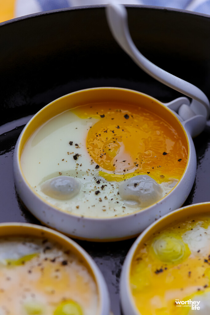 Three fried eggs made using a silicone mold. 