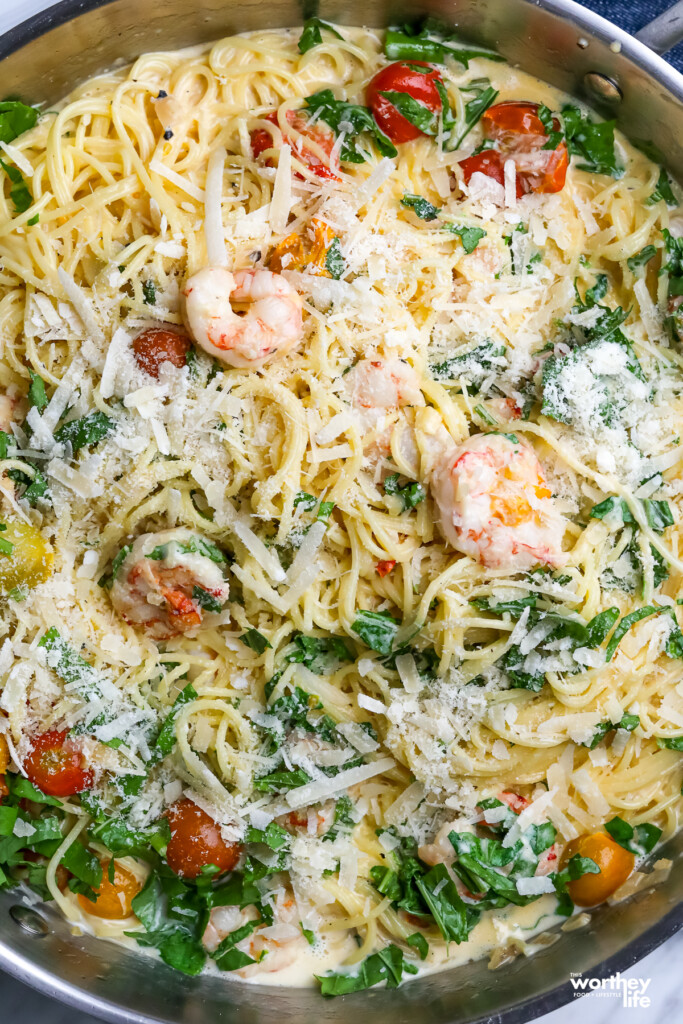 A partial view of our Tomato & Shrimp Alfredo in a skillet.
