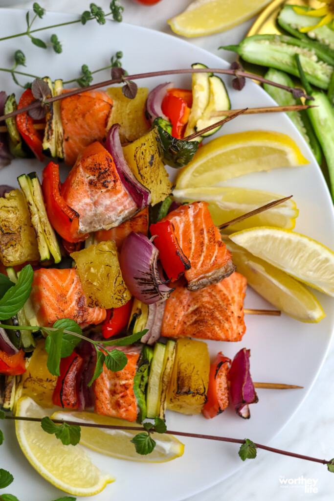 Salmon Kabobs on a white platter