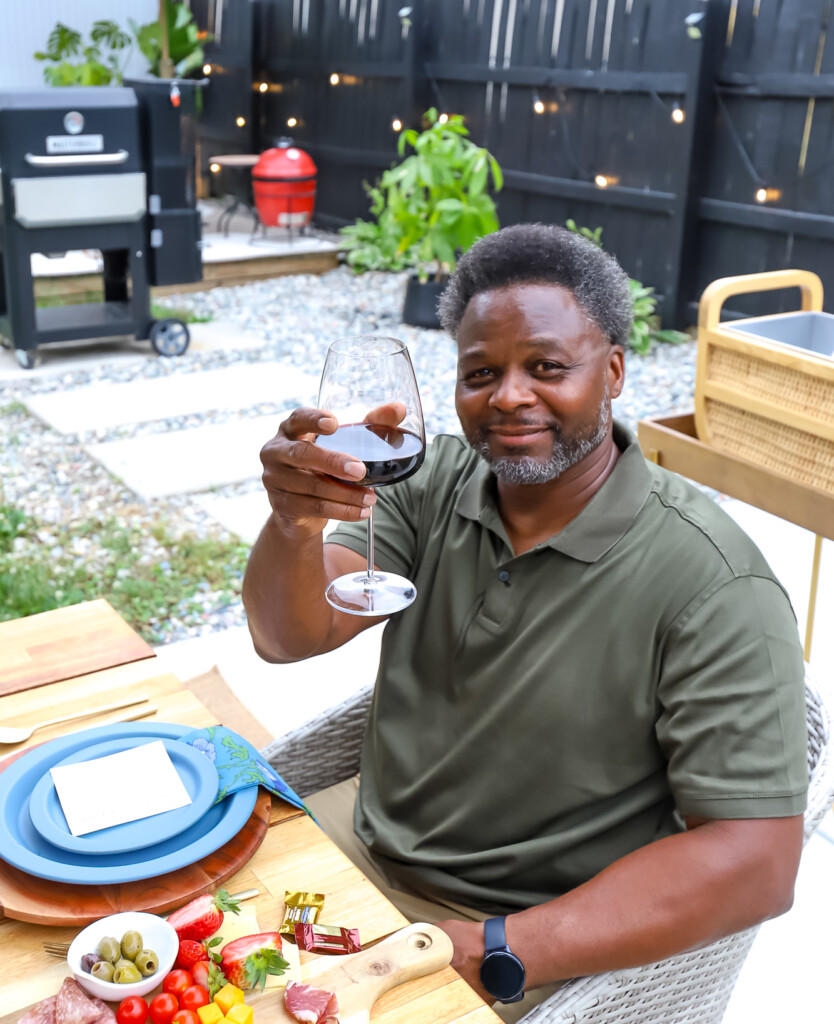 man holding a glass of wine