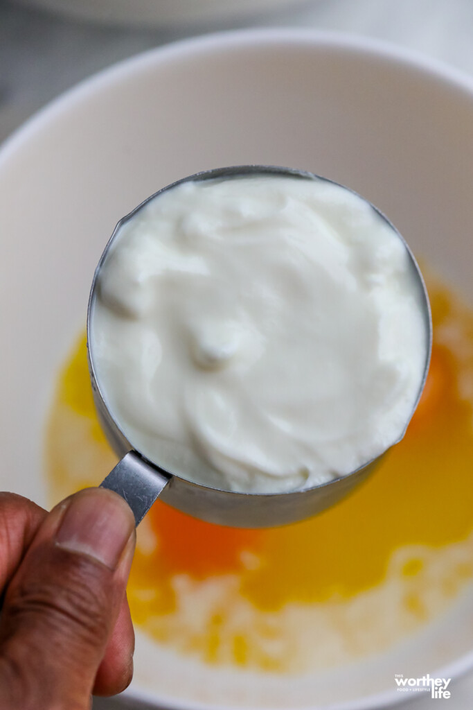 A measuring cup of Greek yogurt. 