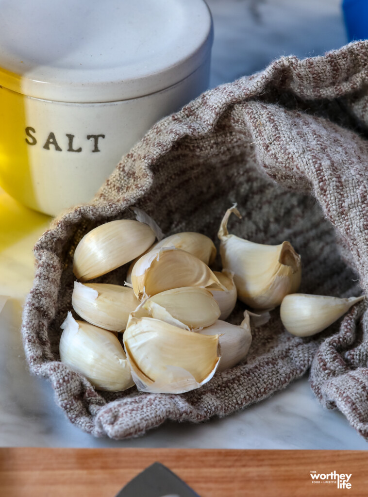 Garlic cloves and salt container