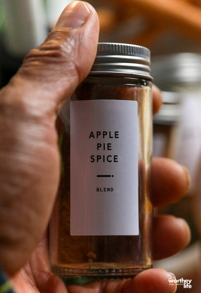 man holding a bottle of apple pie spice