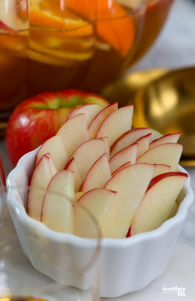 fresh sliced apples in a white small bowl