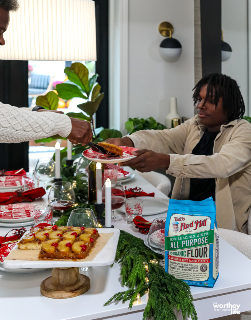 dad serving cake to his son- holiday setting