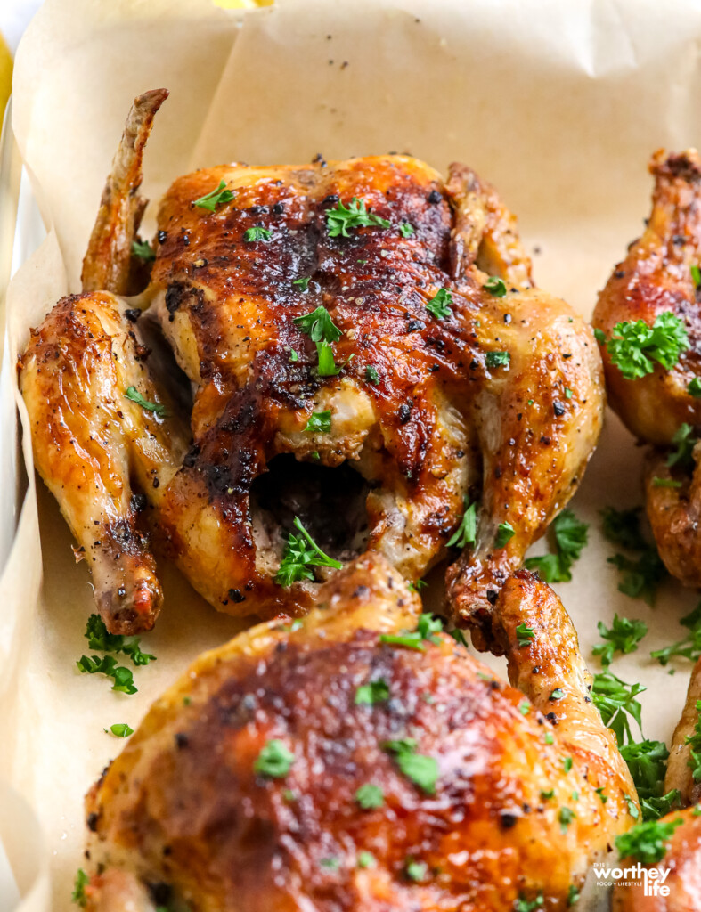 Cornish Hens on parchment paper