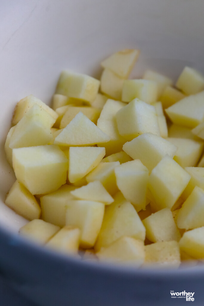 chopped apples in a white bowl