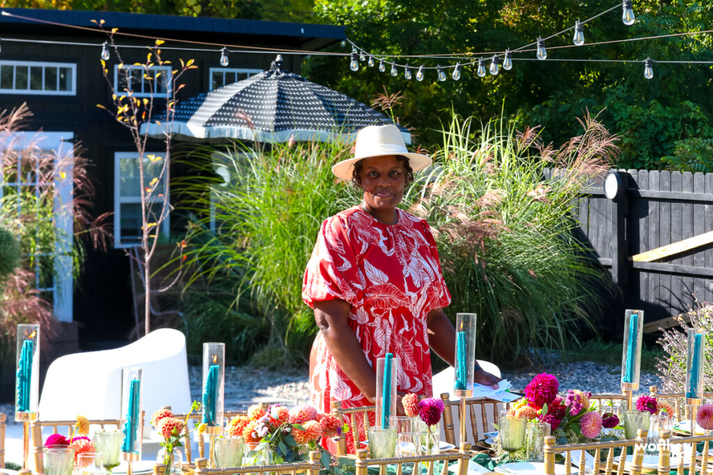 woman setting the table for a dinner party