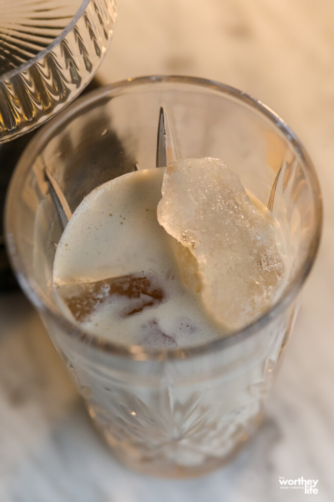 Mixing ingredients in a cocktail shaker with ice