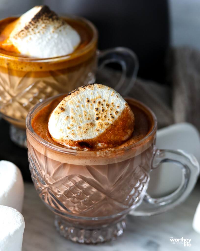 Gingerbread Latte served in crystal cut coffee cups and topped with a toasted marshmallow. 