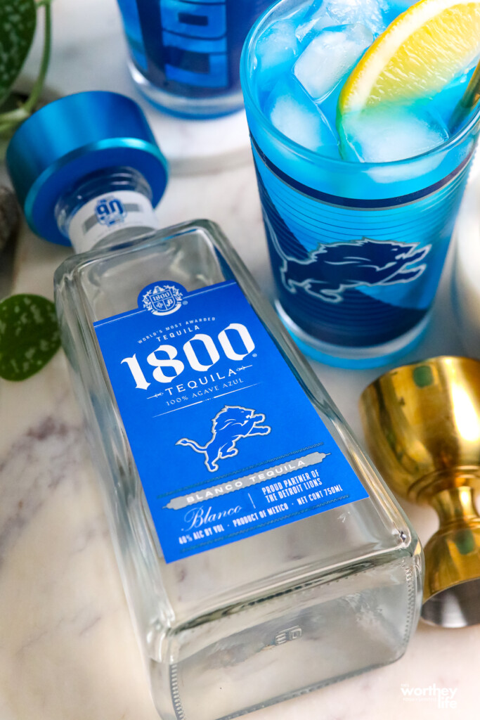 a bottle of 1800 tequila with Detroit Lions branding