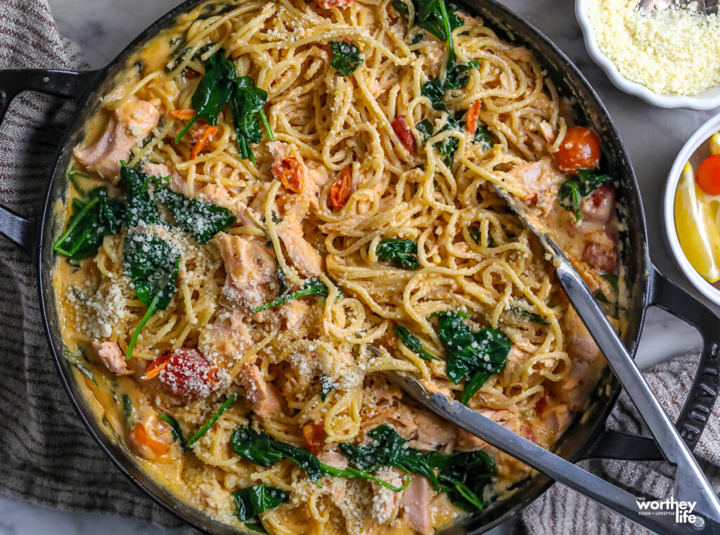 Pasta With Salmon and Spinach Recipe in a cast iron skillet