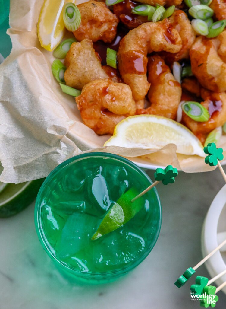 green cocktail with guiness beer battered shrimp
