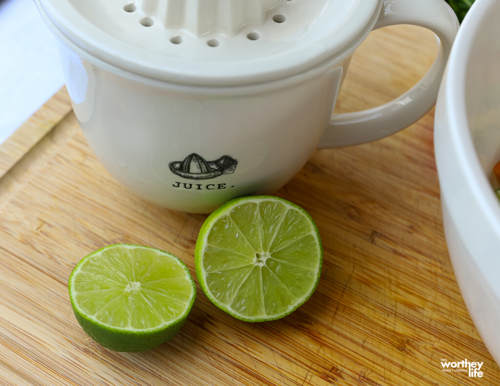 fresh limes on a cutting board