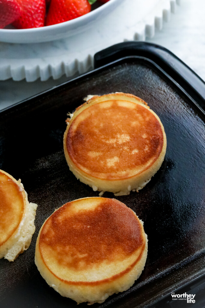 mini pancakes on a griddle