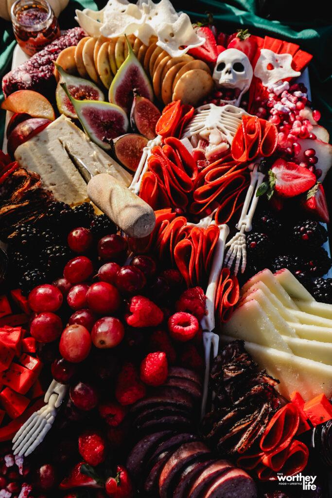 skeleton charcuterie board filled with meat