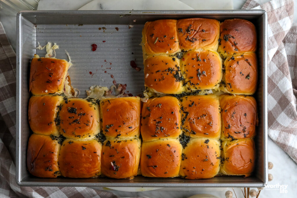 cranberry and turkey sliders in a baking pan
